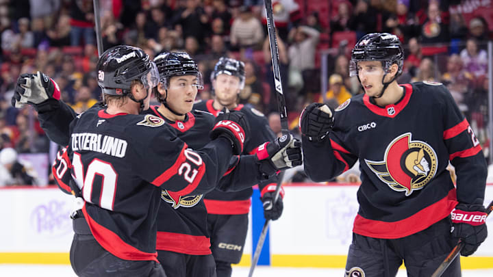 Nov 13, 2025; Ottawa, Ontario, CAN; Ottawa Senators center Dylan Cozens (24) celebrates with left wing Fabian Zetterlund (20) and defenseman Jordan Spence (10) after scoring in the first period against the Boston Bruins at the Canadian Tire Centre. Mandatory Credit: Marc DesRosiers-IMAGN Images