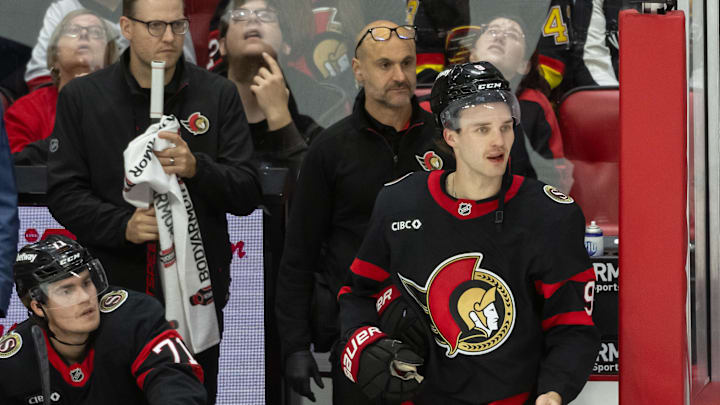 Nov 23, 2024; Ottawa, Ontario, CAN; Ottawa Senators center Josh Norris (9) questions his penalty to the bench in the third period against the Vancouver Canucks at the Canadian Tire Centre. Mandatory Credit: Marc DesRosiers-Imagn Images