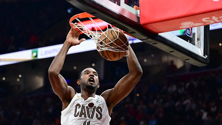 Nov 23, 2025; Cleveland, Ohio, USA; Cleveland Cavaliers center Evan Mobley (4) dunks against the Los Angeles Clippers during the first half at Rocket Arena. Mandatory Credit: Ken Blaze-Imagn Images