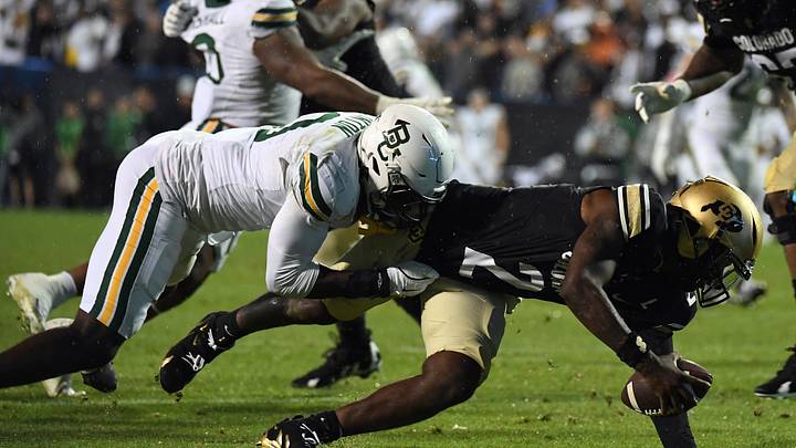 Sep 21, 2024; Boulder, Colorado, USA; Colorado Buffaloes quarterback Shedeur Sanders (2) is sacked by Baylor Bears linebacker Steve Linton Sep 21, 2024; Boulder, Colorado, USA; Colorado Buffaloes quarterback Shedeur Sanders (2) is sacked by Baylor Bears linebacker Steve Linton