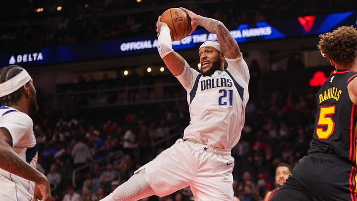Mar 10, 2026; Atlanta, Georgia, USA; Dallas Mavericks forward Daniel Gafford (21) grabs a rebound against the Atlanta Hawks in the third quarter at State Farm Arena. Mandatory Credit: Brett Davis-Imagn Images
