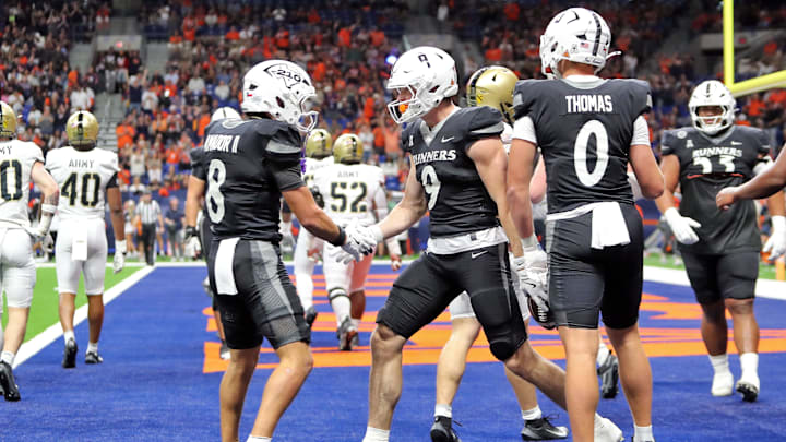 Nov 29, 2025; San Antonio, Texas, USA; UTSA Roadrunners tight end Patrick Overmyer (9) celebrates his touchdown catch against the Army Black Knights during the first half at the Alamodome. Mandatory Credit: Danny Wild-Imagn Images