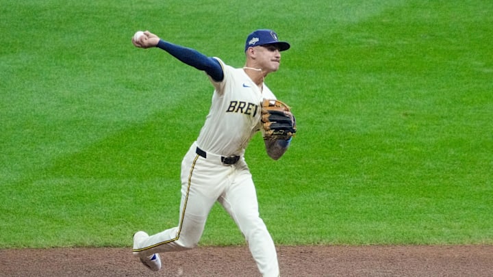 Oct 13, 2025; Milwaukee, Wisconsin, USA; Milwaukee Brewers shortstop Joey Ortiz (3) throws to first base to get out Los Angeles Dodgers center fielder Andy Pages (not pictured) in the fifth inning during game one of the NLCS round for the 2025 MLB playoffs at American Family Field. Mandatory Credit: Michael McLoone-Imagn Images