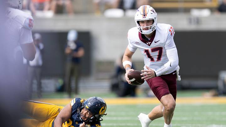 Oct 10, 2026; Berkeley, California, USA; Virginia Tech Hokies quarterback Ethan Grunkemeyer (17) escapes the tackle of California Golden Bears defensive lineman Derek Wilkins (96) during the first quarter at California Memorial Stadium. Mandatory Credit: D. Ross Cameron-Imagn Images Oct 10, 2026; Berkeley, California, USA; Virginia Tech Hokies quarterback Ethan Grunkemeyer (17) escapes the tackle of California Golden Bears defensive lineman Derek Wilkins (96) during the first quarter at California Memorial Stadium. Mandatory Credit: D. Ross Cameron-Imagn Images