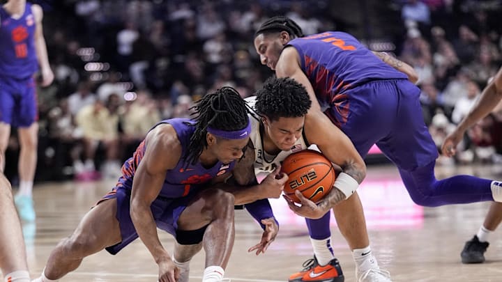 Clemson guards Dillon Hunter (2) and Jestin Porter (1) fight for a contested ball in the Tigers' loss to Wake Forest. 