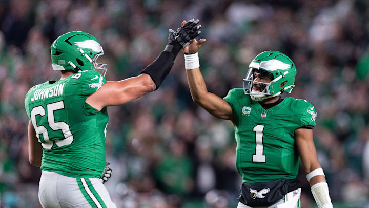 Nov 3, 2024; Philadelphia, Pennsylvania, USA; Philadelphia Eagles quarterback Jalen Hurts (1) and offensive tackle Lane Johnson (65) high five after a Saquon Barkley (not pictured) touchdown run against the Jacksonville Jaguars during the second quarter at Lincoln Financial Field. Mandatory Credit: Bill Streicher-Imagn Images Nov 3, 2024; Philadelphia, Pennsylvania, USA; Philadelphia Eagles quarterback Jalen Hurts (1) and offensive tackle Lane Johnson (65) high five after a Saquon Barkley (not pictured) touchdown run against the Jacksonville Jaguars during the second quarter at Lincoln Financial Field. Mandatory Credit: Bill Streicher-Imagn Images