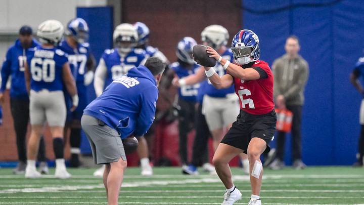 New York Giants quarterback Jaxson Dart (6) participates in a drill during organized team activities at Quest Diagnostics Training Center.  