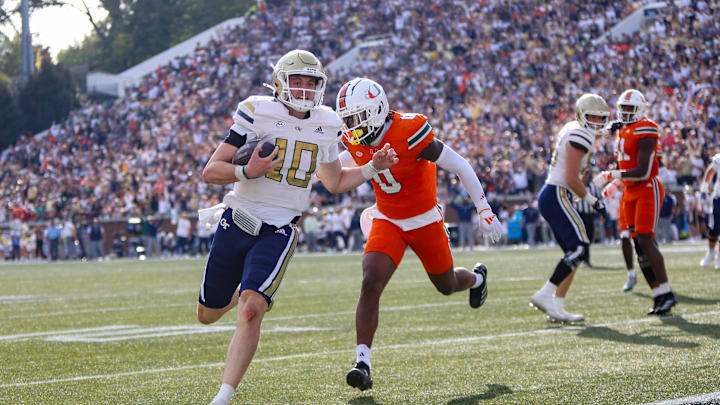 Nov 9, 2024; Atlanta, Georgia, USA; Georgia Tech Yellow Jackets quarterback Haynes King (10) runs for a touchdown against the Miami Hurricanes in the fourth quarter at Bobby Dodd Stadium at Hyundai Field. Mandatory Credit: Brett Davis-Imagn Images
