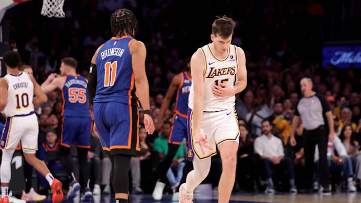 Feb 3, 2024; New York, New York, USA; Los Angeles Lakers guard Austin Reaves (15) celebrates his three point shot against New York Knicks guard Jalen Brunson (11) during the fourth quarter at Madison Square Garden. Mandatory Credit: Brad Penner-Imagn Images