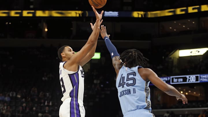 Feb 23, 2026; Memphis, Tennessee, USA; Sacramento Kings forward Keegan Murray (13) shoots as Memphis Grizzlies forward GG Jackson (45) defends during the first quarter at FedExForum. Mandatory Credit: Petre Thomas-Imagn Images