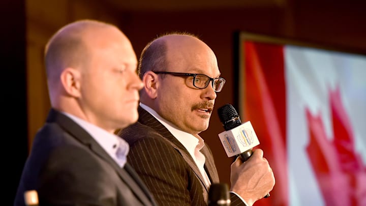 Mar 2, 2016; Toronto, Ontario, Canada;   Team North America general manager Peter Chiarelli (right) speaks to media while associate general manager Stan Bowman listens during a press conference for the upcoming 2016 World Cup of Hockey at Intercontinental Hotel. Mandatory Credit: Dan Hamilton-Imagn Images