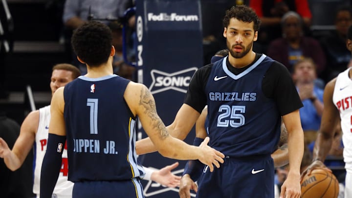 Apr 5, 2024; Memphis, Tennessee, USA; Memphis Grizzlies forward Maozinha Pereira (25) reacts with Scotty Pippen Jr. (1). 