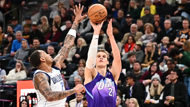Nov 30, 2024; Salt Lake City, Utah, USA; Utah Jazz forward Lauri Markkanen (23) shoots over Dallas Mavericks forward P.J. Washington (25) in the second half at Delta Center. Mandatory Credit: Jamie Sabau-Imagn Images Nov 30, 2024; Salt Lake City, Utah, USA; Utah Jazz forward Lauri Markkanen (23) shoots over Dallas Mavericks forward P.J. Washington (25) in the second half at Delta Center. Mandatory Credit: Jamie Sabau-Imagn Images