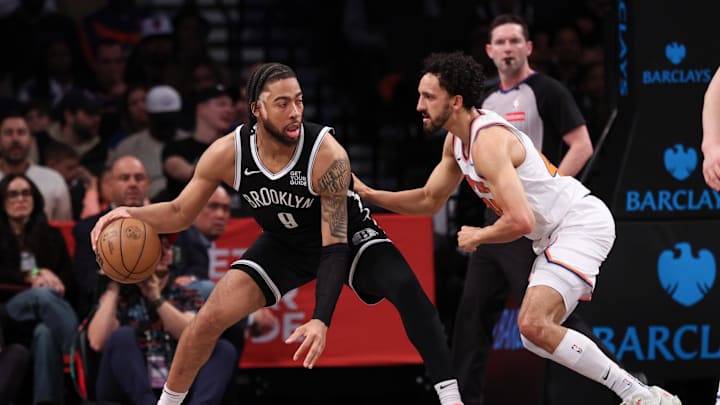 Apr 13, 2025; Brooklyn, New York, USA; Brooklyn Nets forward Trendon Watford (9) is guarded by New York Knicks guard Landry Shamet (44) during the first half at Barclays Center. Mandatory Credit: Vincent Carchietta-Imagn Images