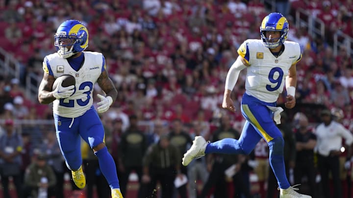 Nov 9, 2025; Santa Clara, California, USA; Los Angeles Rams running back Kyren Williams (23) runs for a touchdown as Los Angeles Rams quarterback Matthew Stafford (9) watches during the first quarter against the San Francisco 49ers at Levi's Stadium. Mandatory Credit: Kyle Terada-Imagn Images