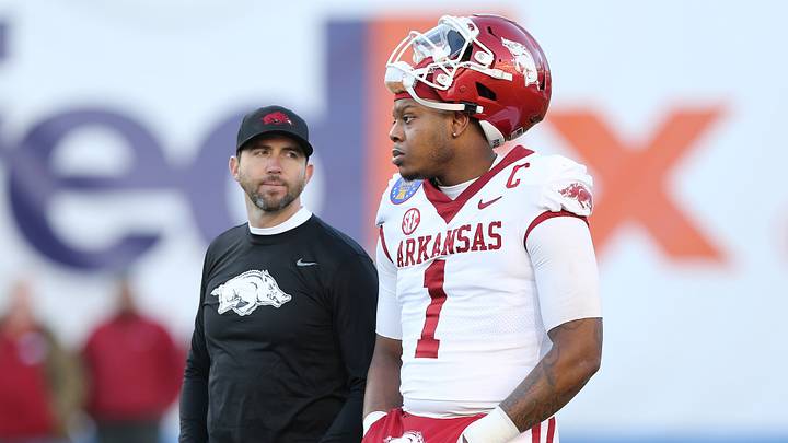 Dec 28, 2022; Memphis, TN, USA; Arkansas Razorbacks offensive coordinator Kendal Briles and quarterback KJ Jefferson (1) talk before the 2022 Liberty Bowl against the Kansas Jayhawks in at Liberty Bowl Memorial Stadium. Mandatory Credit: Nelson Chenault-USA TODAY Sports