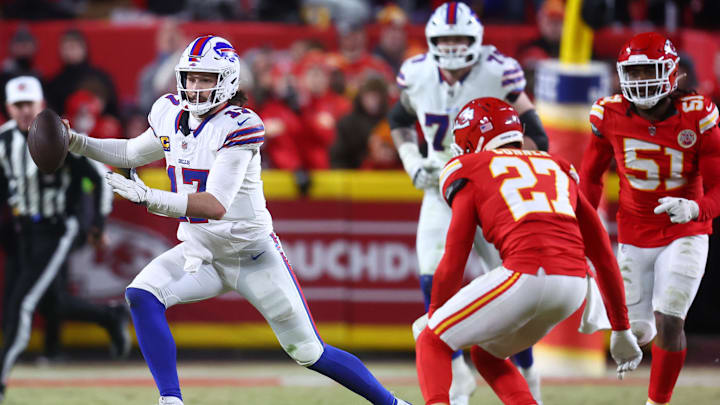 Jan 26, 2025; Kansas City, MO, USA; Buffalo Bills quarterback Josh Allen (17) rushes the ball past Kansas City Chiefs safety Chamarri Conner (27) during the second half in the AFC Championship game at GEHA Field at Arrowhead Stadium. Mandatory Credit: Mark J. Rebilas-Imagn Images