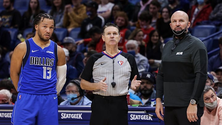 Feb 17, 2022; New Orleans, Louisiana, USA; Dallas Mavericks guard Jalen Brunson (13) and Dallas Mavericks head coach Jason Kidd are talked to by a referee against the New Orleans Pelicans during the second half at the Smoothie King Center. Mandatory Credit: Stephen Lew-Imagn Images