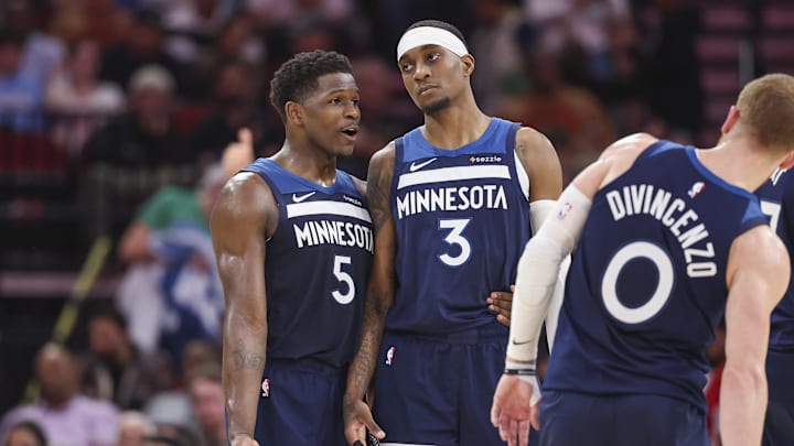 Dec 27, 2024; Houston, Texas, USA; Minnesota Timberwolves guard Anthony Edwards (5) talks with forward Jaden McDaniels (3) during the second quarter against the Houston Rockets at Toyota Center. Mandatory Credit: Troy Taormina-Imagn Images