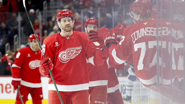 Dec 14, 2024; Detroit, Michigan, USA;  Detroit Red Wings defenseman Jeff Petry (46) receives congratulations from teammates after scoring at Little Caesars Arena. Mandatory Credit: Rick Osentoski-Imagn Images