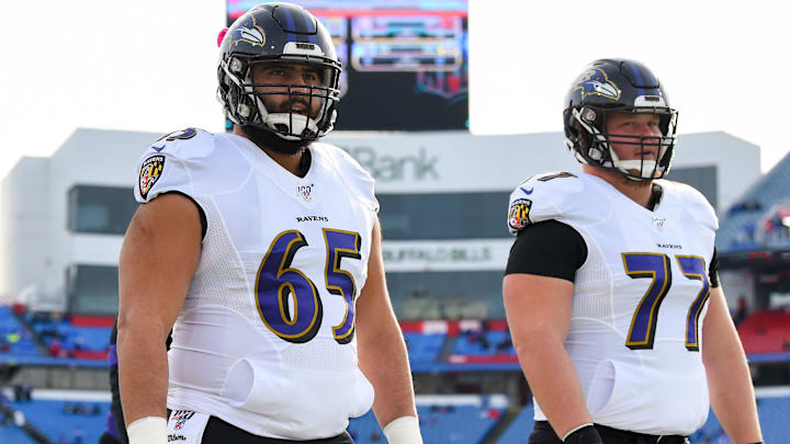 Dec 8, 2019; Orchard Park, NY, USA; Baltimore Ravens offensive guards Patrick Mekari (65) and Bradley Bozeman (77) walk on the field prior to the game against the Buffalo Bills at New Era Field. Mandatory Credit: Rich Barnes-Imagn Images