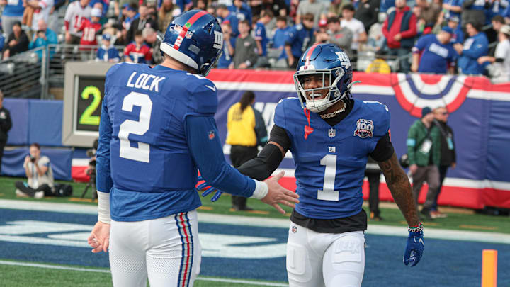 Dec 29, 2024; East Rutherford, New Jersey, USA; New York Giants wide receiver Malik Nabers (1) celebrates with quarterback Drew Lock (2) after a touchdown reception during the first half against the Indianapolis Colts at MetLife Stadium.  