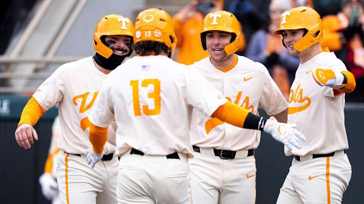 Teammates wait at home to congratulate Tennessee's Reese Chapman (13) after Chapman hit a grand slam during a college baseball game between Tennessee and Hofstra at Lindsey Nelson Stadium in Knoxville on Sunday, Feb. 16, 2025.