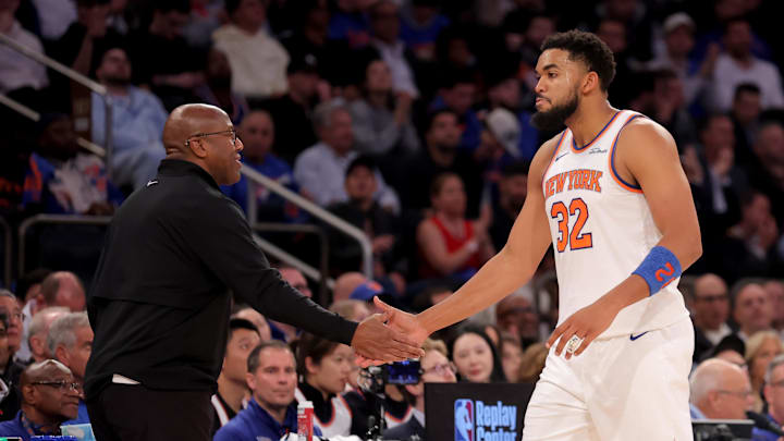 Oct 22, 2025; New York, New York, USA; New York Knicks head coach Mike Brown high fives center Karl-Anthony Towns (32) during the fourth quarter against the Cleveland Cavaliers at Madison Square Garden. Mandatory Credit: Brad Penner-Imagn Images