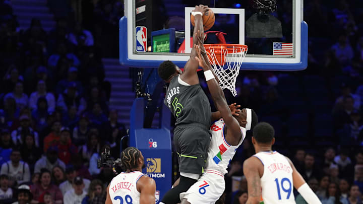 Apr 5, 2025; Philadelphia, Pennsylvania, USA; Minnesota Timberwolves guard Anthony Edwards (5) dunks against Philadelphia 76ers center Adem Bona (30) in the first quarter at Wells Fargo Center.