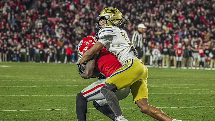 Nov 29, 2024; Athens, Georgia, USA; Georgia Bulldogs wide receiver Dominic Lovett (6) catches a touchdown pass in front of Georgia Tech Yellow Jackets defensive back Syeed Gibbs (16) during the second half at Sanford Stadium. Mandatory Credit: Dale Zanine-Imagn Images