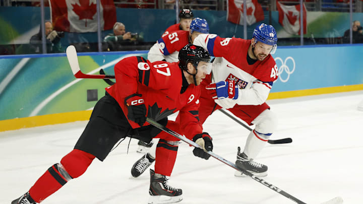 Feb 18, 2026; Milan, Italy; Connor McDavid of Canada controls the puck against Tomas Hertl of Czechia in a men's ice hockey quarterfinal during the Milano Cortina 2026 Olympic Winter Games at Milano Santagiulia Ice Hockey Arena. Mandatory Credit: Geoff Burke-Imagn Images Feb 18, 2026; Milan, Italy; Connor McDavid of Canada controls the puck against Tomas Hertl of Czechia in a men's ice hockey quarterfinal during the Milano Cortina 2026 Olympic Winter Games at Milano Santagiulia Ice Hockey Arena. Mandatory Credit: Geoff Burke-Imagn Images