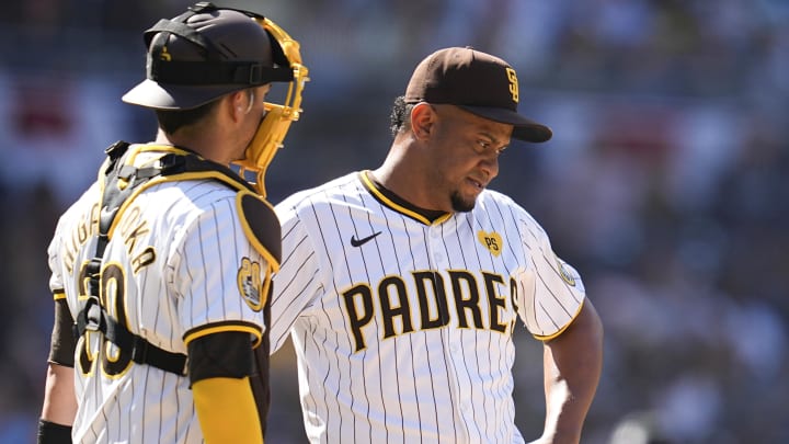 Apr 3, 2024; San Diego, California, USA; San Diego Padres catcher Kyle Higashioka (20) speaks with relief pitcher Wandy Peralta (58) on the mound during the eighth inning against the St. Louis Cardinals at Petco Park. Mandatory Credit: Ray Acevedo-USA TODAY Sports