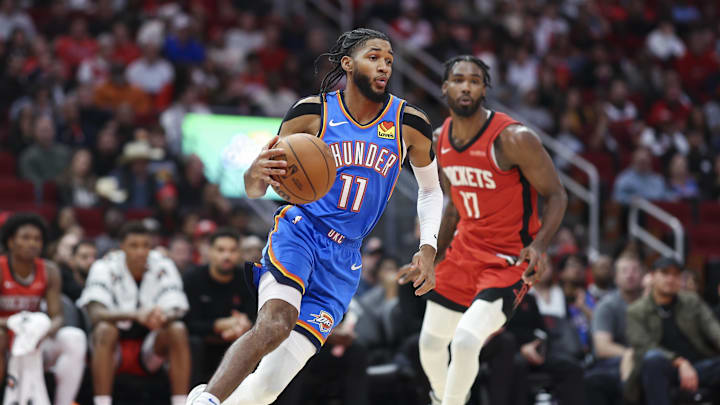 Dec 1, 2024; Houston, Texas, USA; Oklahoma City Thunder guard Isaiah Joe (11) dribbles the ball as Houston Rockets forward Tari Eason (17) defends during the game at Toyota Center. Mandatory Credit: Troy Taormina-Imagn Images Dec 1, 2024; Houston, Texas, USA; Oklahoma City Thunder guard Isaiah Joe (11) dribbles the ball as Houston Rockets forward Tari Eason (17) defends during the game at Toyota Center. Mandatory Credit: Troy Taormina-Imagn Images