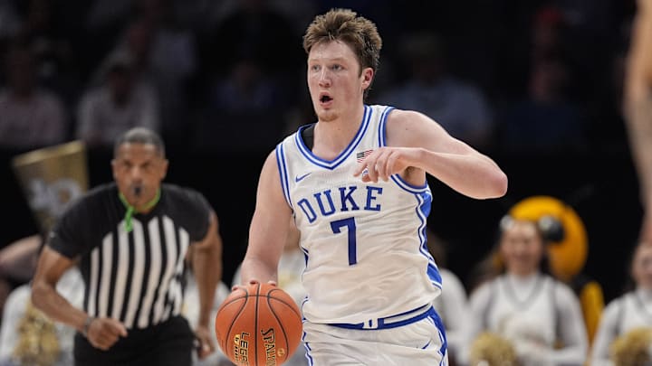 Mar 13, 2025; Charlotte, NC, USA; Duke Blue Devils guard Kon Knueppel (7) brings the ball up court against the Georgia Tech Yellow Jackets during the second half at Spectrum Center. Mandatory Credit: Jim Dedmon-Imagn Images
