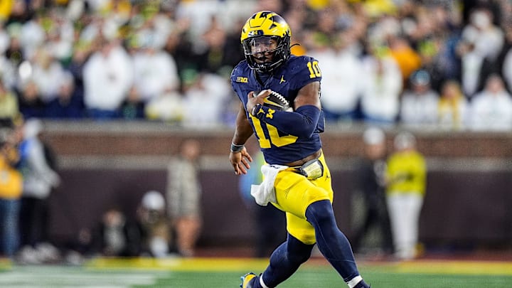 Michigan quarterback Alex Orji (10) runs against Oregon during the second half at Michigan Stadium in Ann Arbor on Saturday, Nov. 2, 2024.
