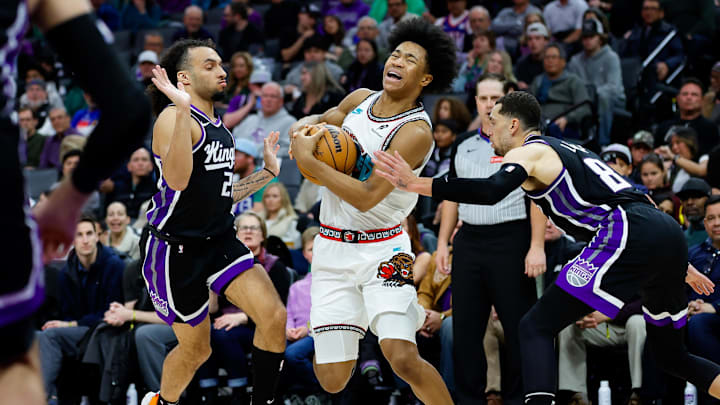 Mar 17, 2025; Sacramento, California, USA; Memphis Grizzlies forward Jaylen Wells (0) is fouled by Sacramento Kings guard Zach LaVine (8) during the fourth quarter at Golden 1 Center. Mandatory Credit: Sergio Estrada-Imagn Images
