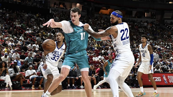 Jul 12, 2025; Las Vegas, NV, USA; Charlotte Hornets center Ryan Kalkbrenner (11) is fouled by Philadelphia 76ers forward Johni Broome (22) in the fourth quarter of their game at Thomas & Mack Center. Mandatory Credit: Candice Ward-Imagn Images