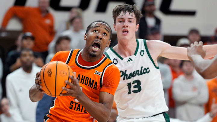 Oklahoma State Cowboys guard Bryce Thompson (1) puts up a shot beside Green Bay Phoenix forward Marcus Hall (13) during a college basketball game between the Oklahoma State Cowboys (OSU) and the Green Bay Phoenix at Gallagher-Iba Arena in Stillwater, Okla., Monday, Nov. 4, 2024. Oklahoma State Cowboys guard Bryce Thompson (1) puts up a shot beside Green Bay Phoenix forward Marcus Hall (13) during a college basketball game between the Oklahoma State Cowboys (OSU) and the Green Bay Phoenix at Gallagher-Iba Arena in Stillwater, Okla., Monday, Nov. 4, 2024.