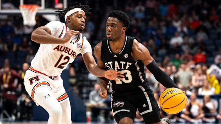 Auburn guard Denver Jones (12) defends against Mississippi State guard Josh Hubbard (13) during the first half of an SEC tournament semifinal game at Bridgestone Arena in Nashville, Tenn., Saturday, March 16, 2024. Auburn guard Denver Jones (12) defends against Mississippi State guard Josh Hubbard (13) during the first half of an SEC tournament semifinal game at Bridgestone Arena in Nashville, Tenn., Saturday, March 16, 2024.