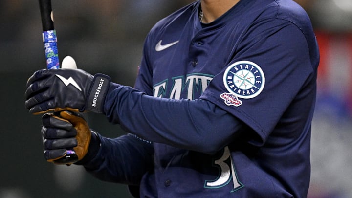 May 2, 2025; Arlington, Texas, USA; A view of the Seattle Mariners logo and MLB Debut logo on the jersey of right fielder Rhylan Thomas (31) during the second inning against the Texas Rangers at Globe Life Field. Mandatory Credit: Jerome Miron-Imagn Images May 2, 2025; Arlington, Texas, USA; A view of the Seattle Mariners logo and MLB Debut logo on the jersey of right fielder Rhylan Thomas (31) during the second inning against the Texas Rangers at Globe Life Field. Mandatory Credit: Jerome Miron-Imagn Images