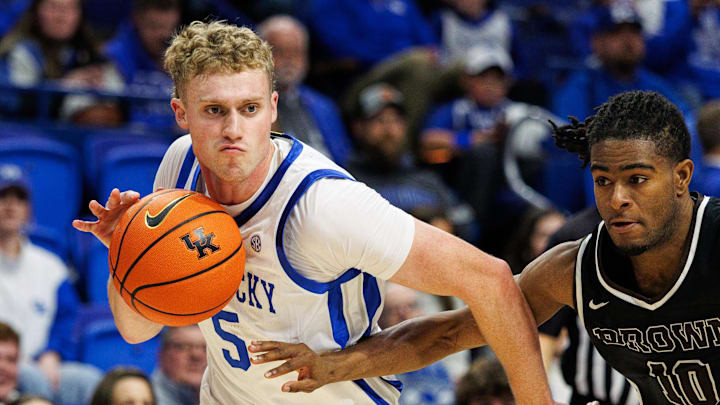 Dec 31, 2024; Lexington, Kentucky, USA; Kentucky Wildcats guard Collin Chandler (5) drives to the basket around Brown Bears guard Kino Lilly Jr. (10) during the second half at Rupp Arena at Central Bank Center. Mandatory Credit: Jordan Prather-Imagn Images