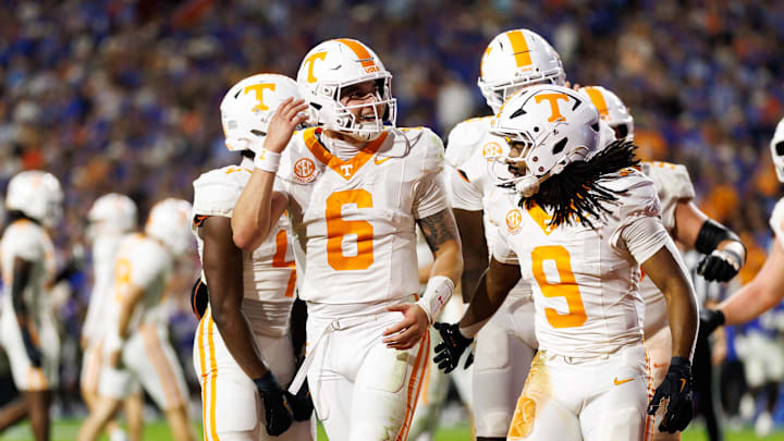 Nov 22, 2025; Gainesville, Florida, USA; Tennessee Volunteers quarterback Joey Aguilar (6) and Tennessee Volunteers running back Star Thomas (9) celebrate towards the crowd after a touchdown against the Florida Gators during the first half at Ben Hill Griffin Stadium. Mandatory Credit: Matt Pendleton-Imagn Images