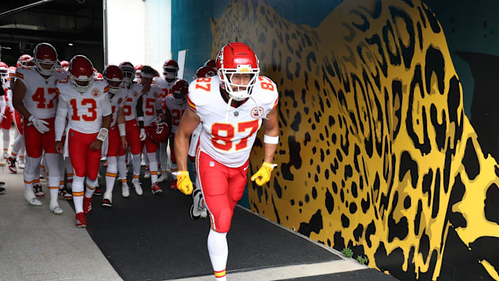 Aug 10, 2024; Jacksonville, Florida, USA; Kansas City Chiefs tight end Travis Kelce (87) leads the team on to the field for warm ups before a  preseason game against the Jacksonville Jaguars at EverBank Stadium. Mandatory Credit: Nathan Ray Seebeck-Imagn Images