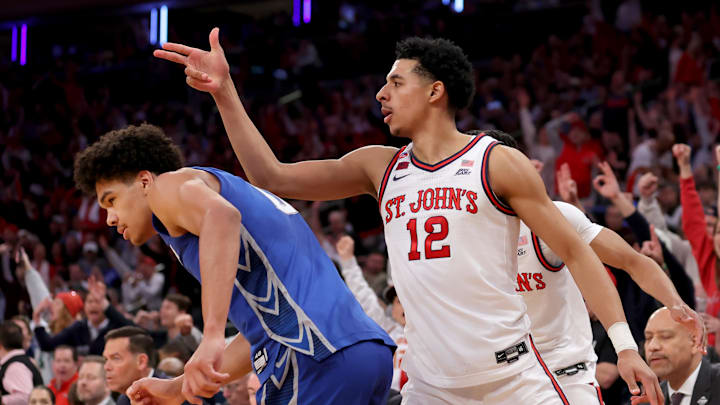 Mar 15, 2025; New York, NY, USA; St. John's basketball guard RJ Luis Jr. (12) celebrates his three point shot against Creighton Bluejays forward Jasen Green (0) during the second half at Madison Square Garden.