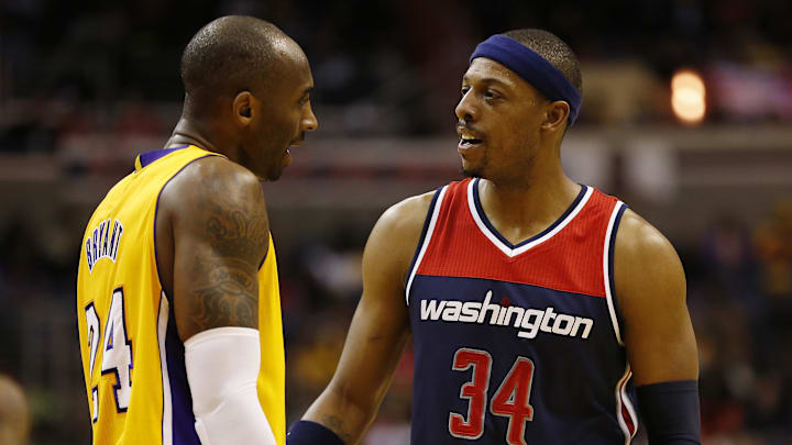 Dec 3, 2014; Washington, DC, USA; Washington Wizards forward Paul Pierce (34) talks to Los Angeles Lakers guard Kobe Bryant (24) in the third quarter at Verizon Center. The Wizards won 111-95. Mandatory Credit: Geoff Burke-Imagn Images