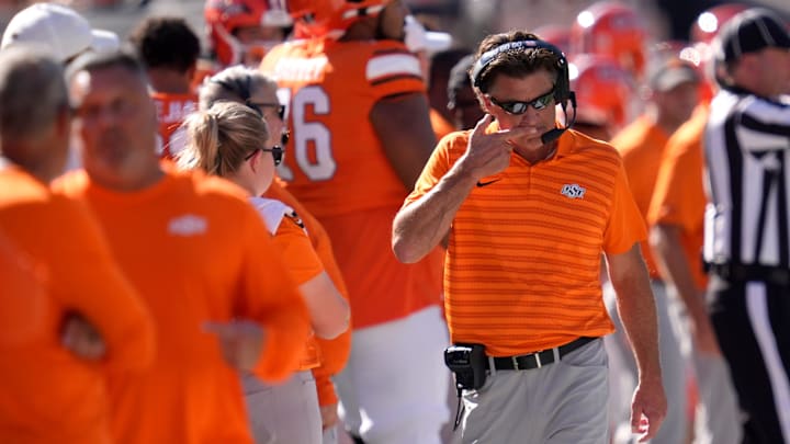 Oklahoma State coach Mike Gundy walks on the sideline during a college football game between the Oklahoma State Cowboys (OSU) and the West Virginia Mountaineers at Boone Pickens Stadium in Stillwater, Okla., Saturday, Oct. 5, 2024.