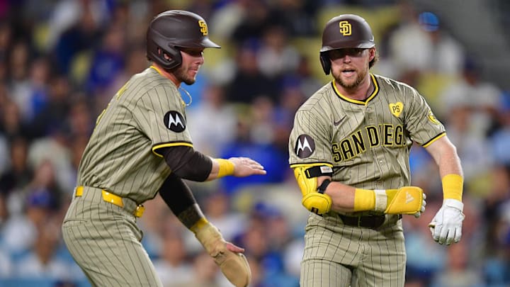 Sep 24, 2024; Los Angeles, California, USA; San Diego Padres second baseman Jake Cronenworth (9) is greeted by center fielder Jackson Merrill (3) after hitting a two run home run against the Los Angeles Dodgers during the second inning at Dodger Stadium. Mandatory Credit: Gary A. Vasquez-Imagn Images Sep 24, 2024; Los Angeles, California, USA; San Diego Padres second baseman Jake Cronenworth (9) is greeted by center fielder Jackson Merrill (3) after hitting a two run home run against the Los Angeles Dodgers during the second inning at Dodger Stadium. Mandatory Credit: Gary A. Vasquez-Imagn Images