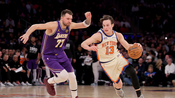 Feb 1, 2026; New York, New York, USA; New York Knicks guard Tyler Kolek (13) drives around Los Angeles Lakers guard Luka Doncic (77) during the second quarter at Madison Square Garden. Mandatory Credit: Brad Penner-Imagn Images Feb 1, 2026; New York, New York, USA; New York Knicks guard Tyler Kolek (13) drives around Los Angeles Lakers guard Luka Doncic (77) during the second quarter at Madison Square Garden. Mandatory Credit: Brad Penner-Imagn Images
