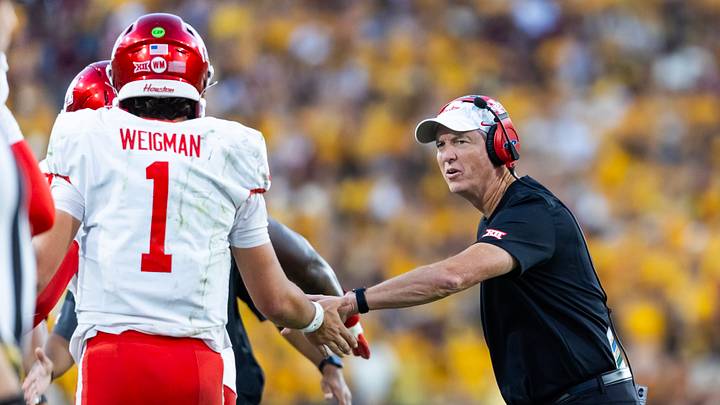 Oct 25, 2025; Tempe, Arizona, USA; Houston Cougars head coach Willie Fritz with quarterback Conner Weigman (1) against the Arizona State Sun Devils at Mountain America Stadium. Mandatory Credit: Mark J. Rebilas-Imagn Images Oct 25, 2025; Tempe, Arizona, USA; Houston Cougars head coach Willie Fritz with quarterback Conner Weigman (1) against the Arizona State Sun Devils at Mountain America Stadium. Mandatory Credit: Mark J. Rebilas-Imagn Images