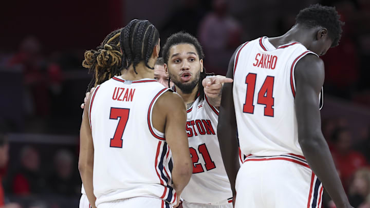 Houston Cougars guard Emanuel Sharp (21) talks with guard Milos Uzan (7) 
